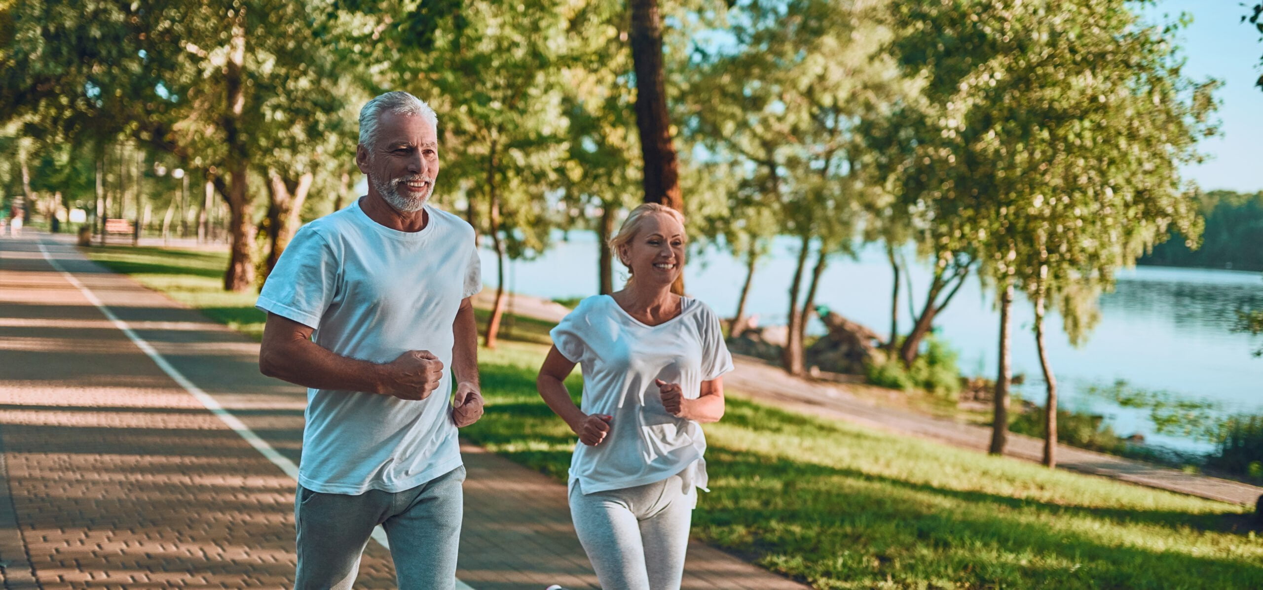 Senior,Couple,Is,Doing,Sport,Outdoors.,Running,In,Park,In